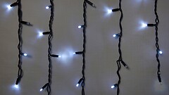 Фото Delux Icicle 75 LED 2x0.7 м черный/белый flash IP44 EN (90020890)