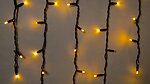 Фото Delux Icicle 75 LED 2x0.7 м чорний/жовтий flash IP44 EN (90020891)