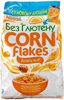 Фото Nestle сухий сніданок Gold мед і арахіс 500 г